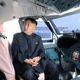 Illustration for article titled Heres Kim Jong Un Pretending To Fly A Plane For Some Reason